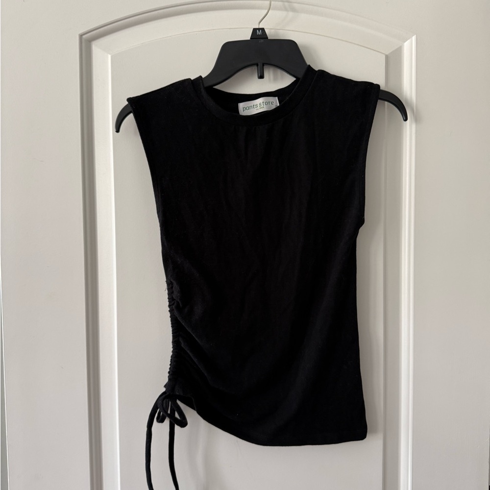 Black Sleeveless Muscle Tee by [Brand]
